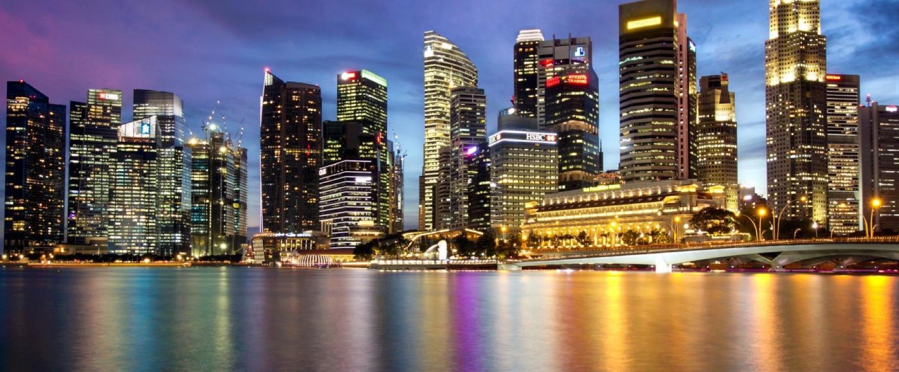 The Singapore central business district at night, seen across Marina Bay